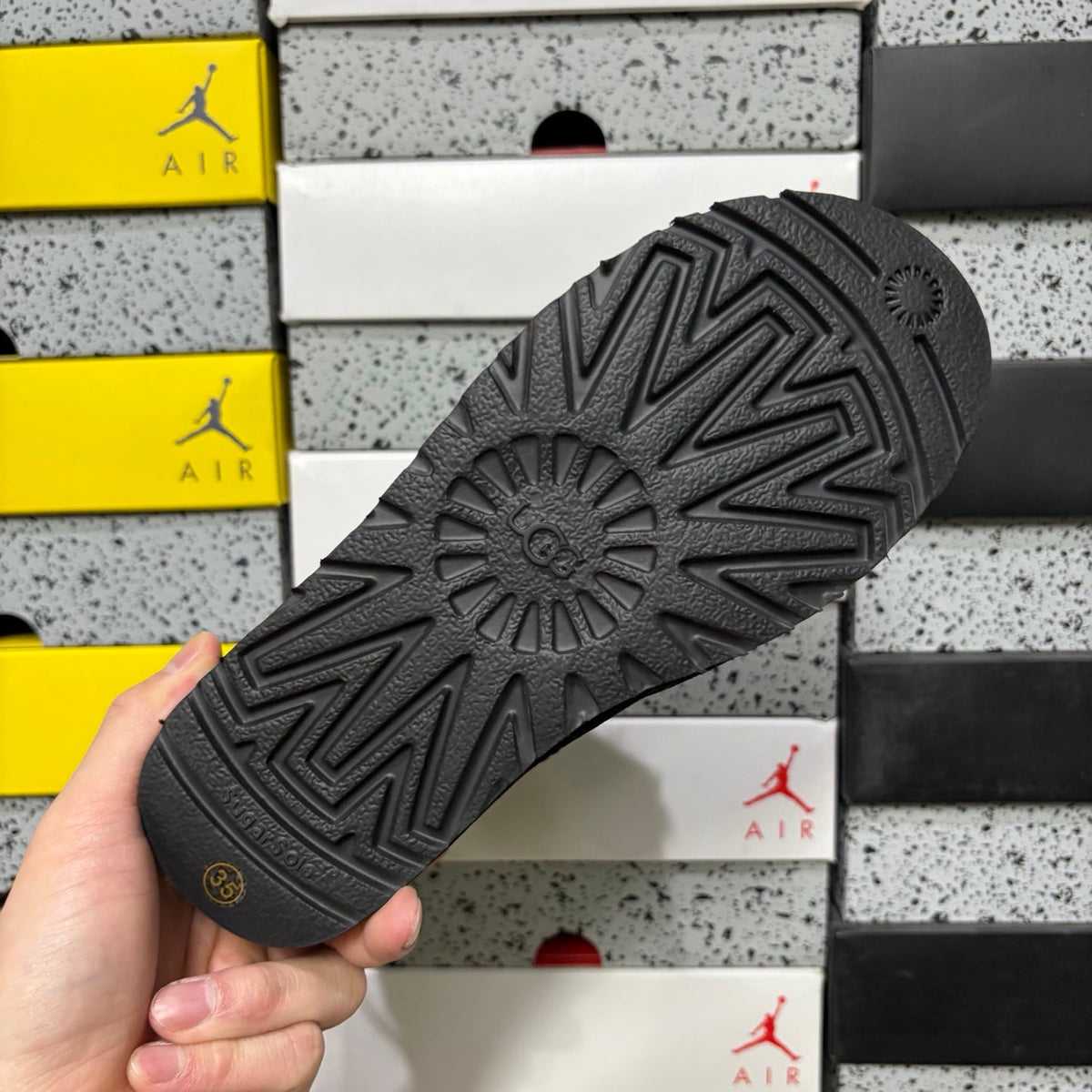 UGG Mini Bailey Bow Ankle Boot – Suede Boot with Tonal Black Shearling Lining, Black Satin Bow & All-Black Lug Sole in Black